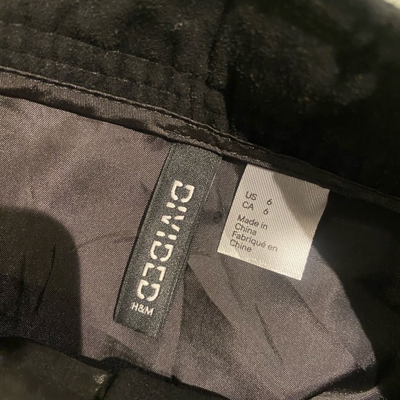 Black suede mini skirt with silver buttons in front. - Picture 3 of 3